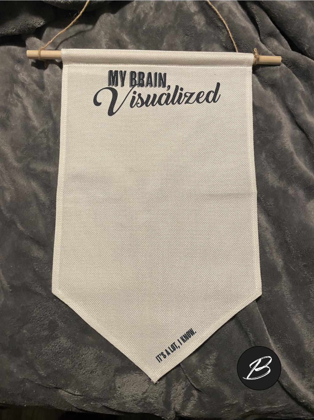 Blank canvas wall banner for displaying enamel pin collections. Text at the top reads "My Brain, Visualized" in a mix of bold and script fonts. Bottom text reads "It's A Lot, I Know."