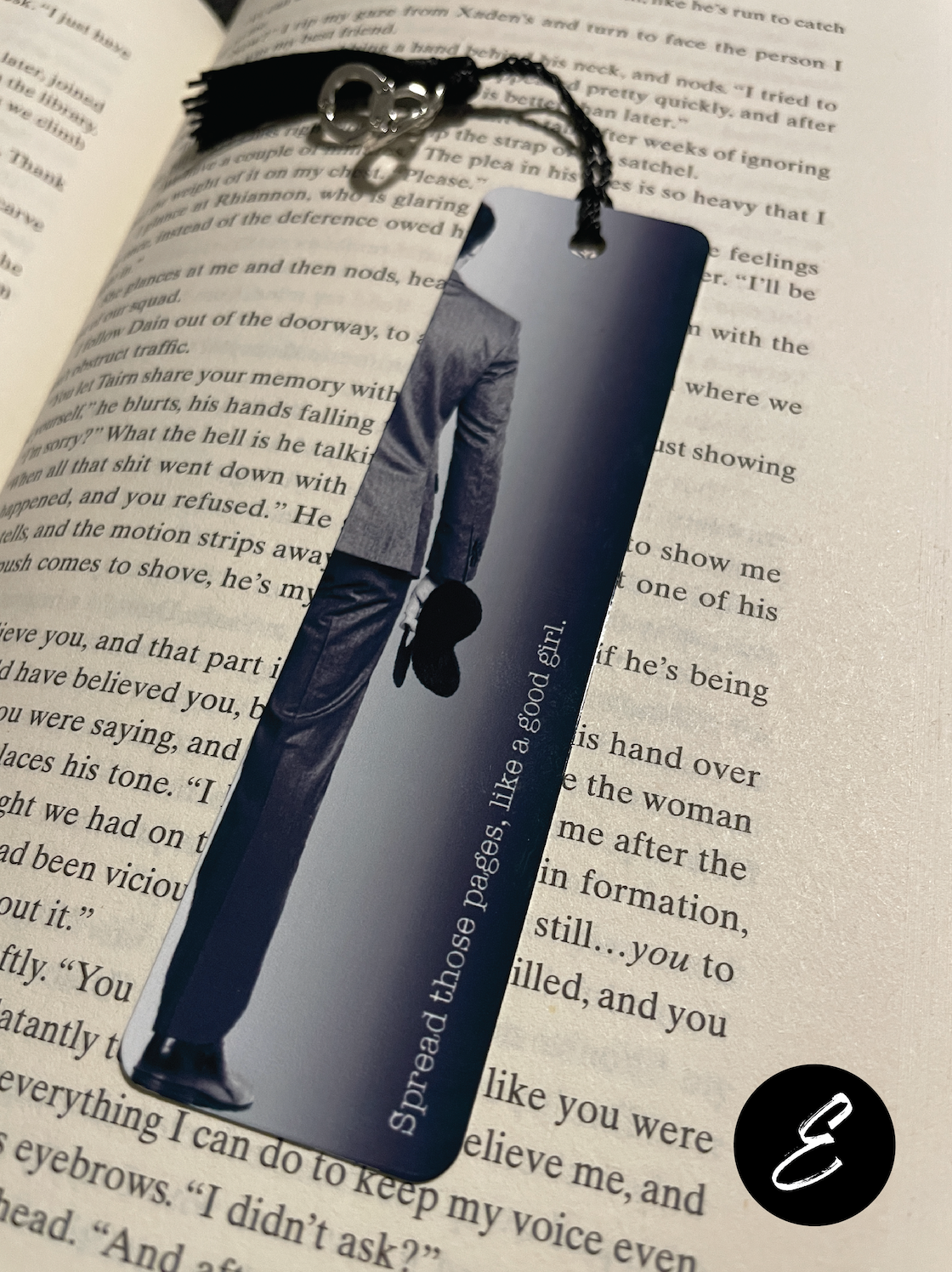Smut Bookmark with a person's silhouette and text on an open book